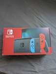 Konsola Nintendo Switch , trzy gry oraz materiałowe opakowanie