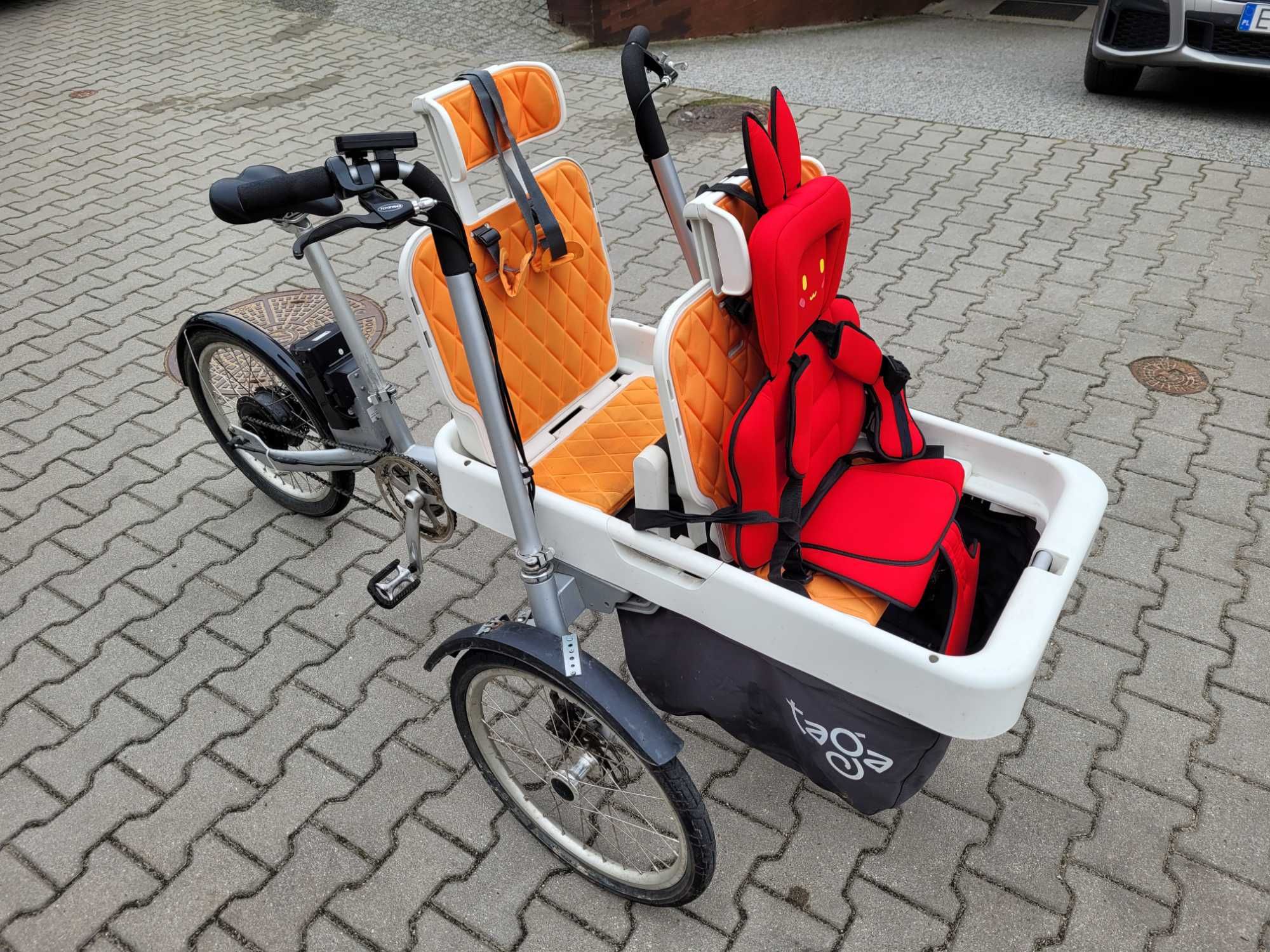 Rower rodzinny trójkołowy towarowy (cargo) elektryczny Taga Bike