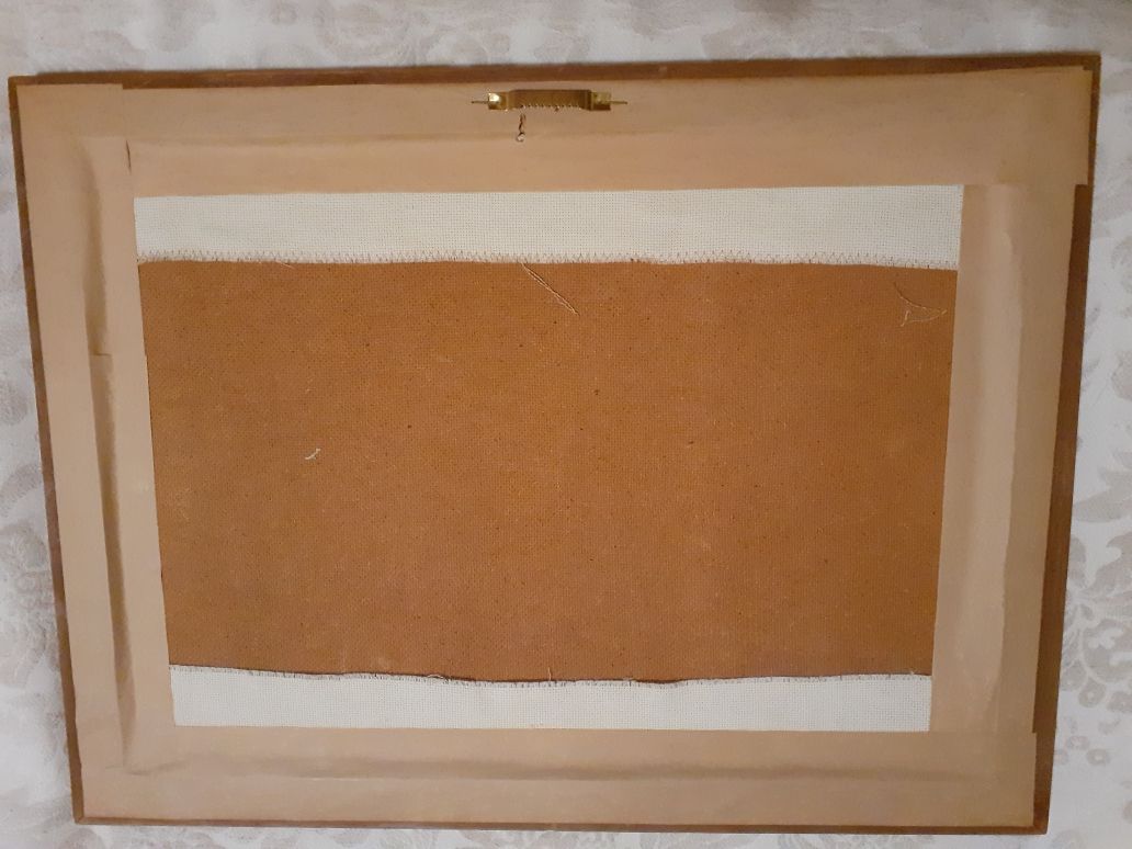 Quadro bordado em ponto de cruz.