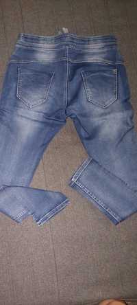 Damskie spodnie jeans z suwakami