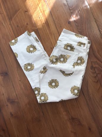 Spodnie damskie kremowe w słoneczniki marki Guess rozmiar XS,xxs nowe