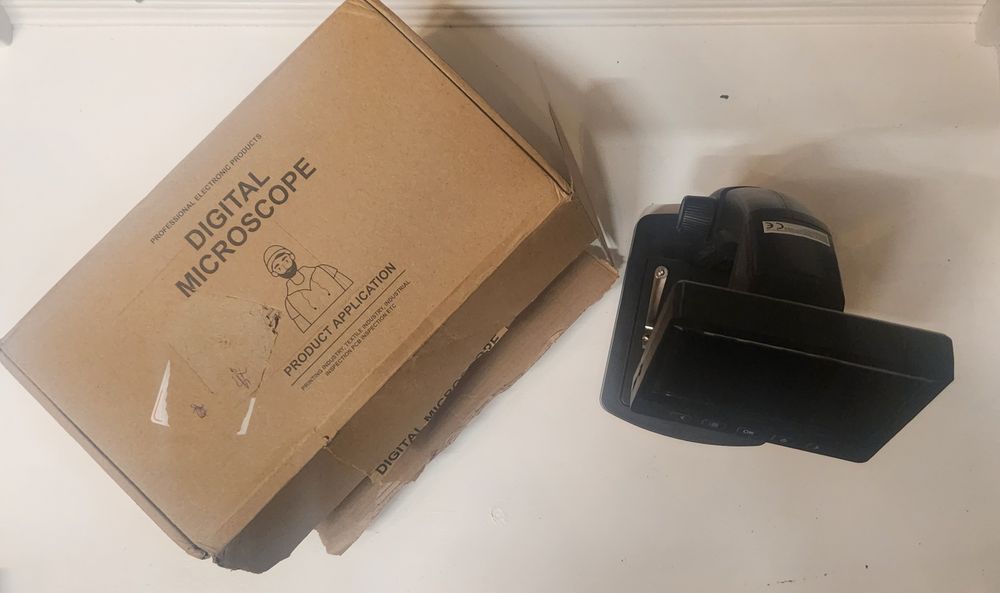 Microscópio a bateria novo