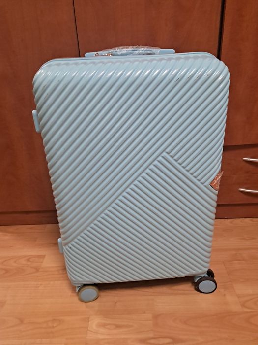 Walizka  na 4 kółkach, niebieska. 60/40/25.