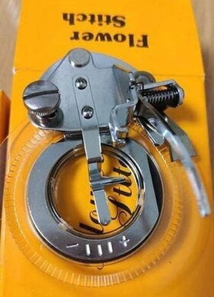 Лапка пристрій для вишивання кругових візерунків.