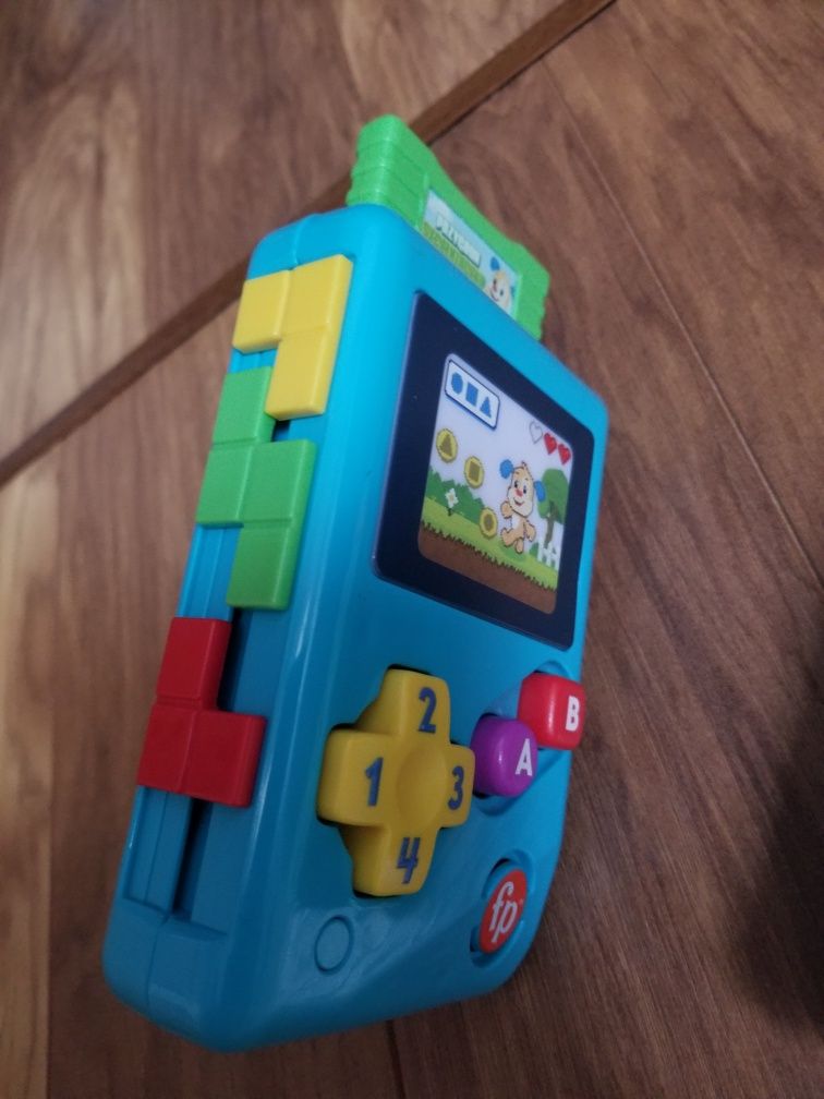 Zabawki interaktywne fisher price konsola zegarek clementoni bajka 6m+