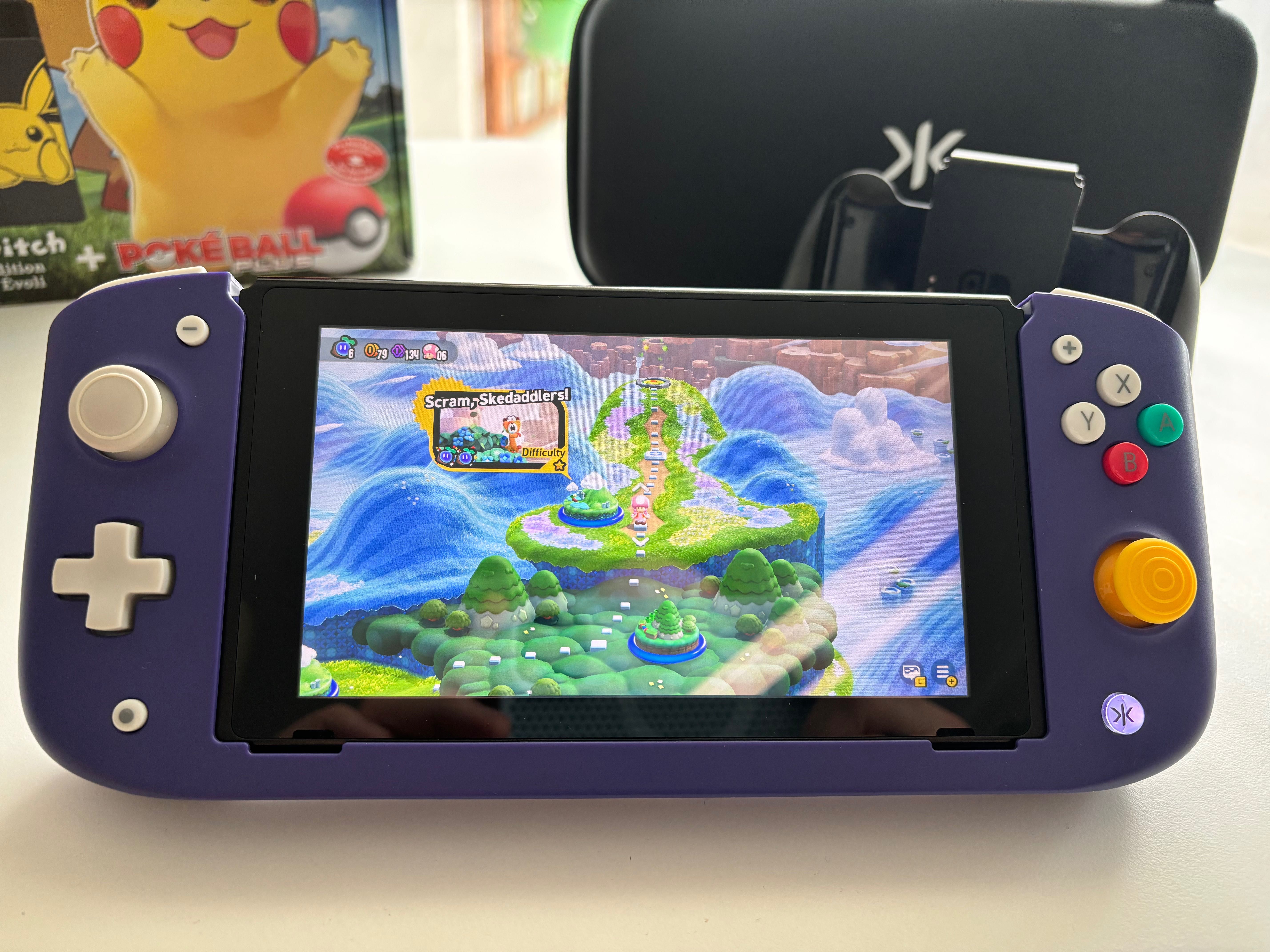 Nintendo Switch Let's Go Pikachu & Eevee Edition + Gry + Nitro Deck