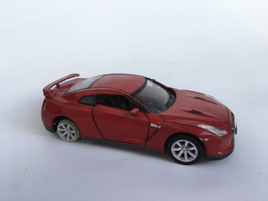 детская игрушка моделька машина машинка вишневая Kinsmart Nissan 2009