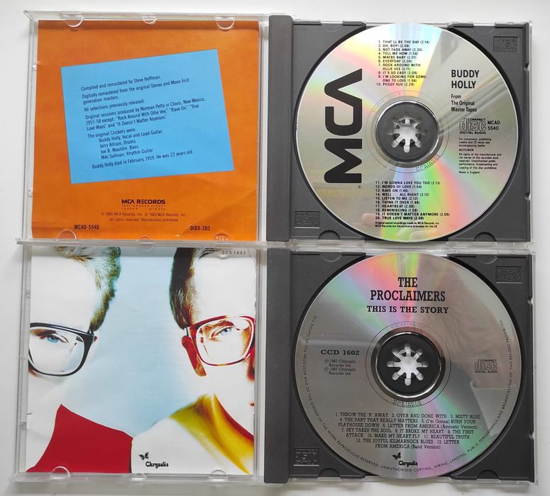 Buddy Holly, Proclaimers, Simon & Garfunkel, Paul Simon Фирменные CD