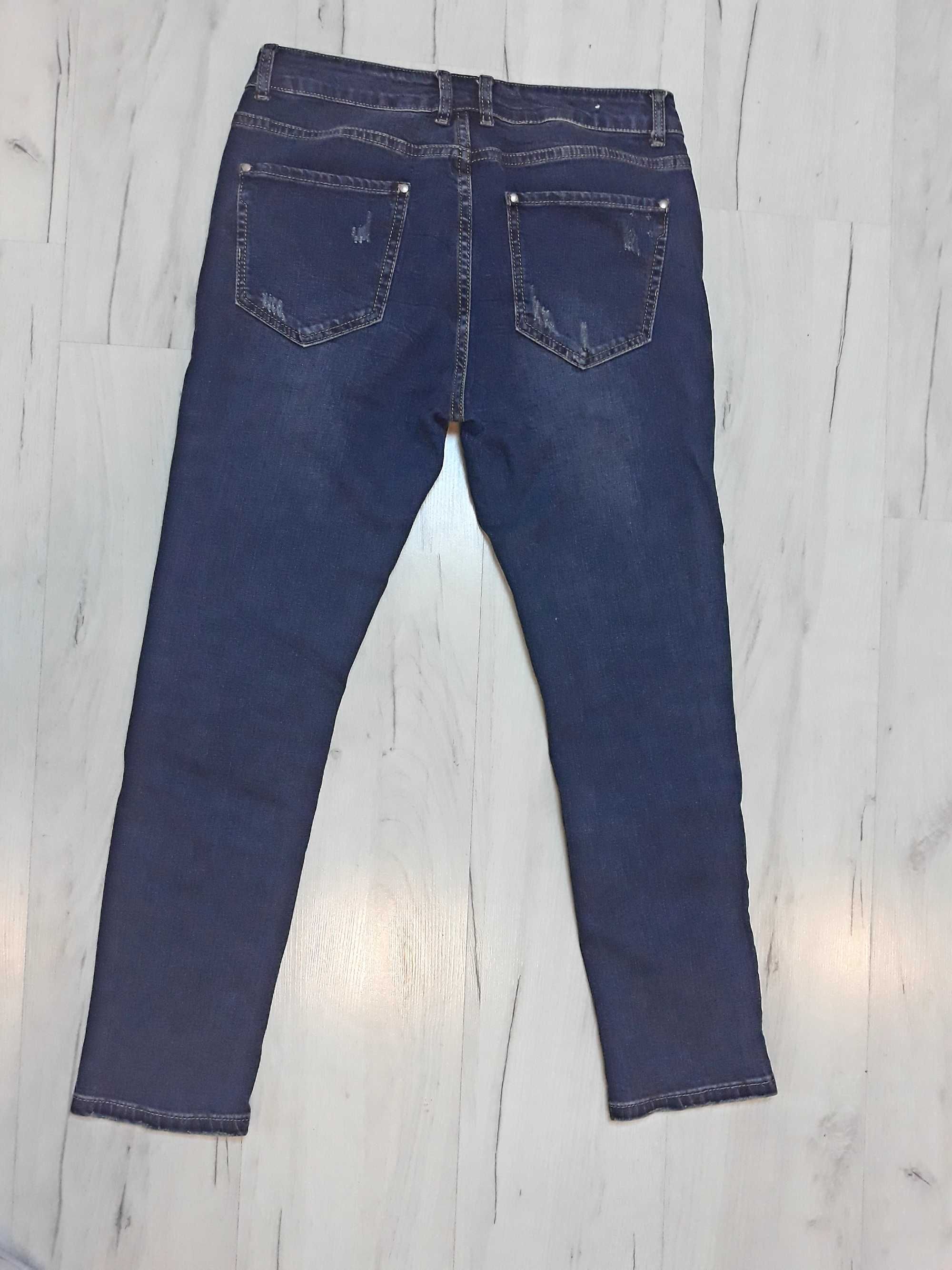 spodnie jeans z przetarciami  r.28