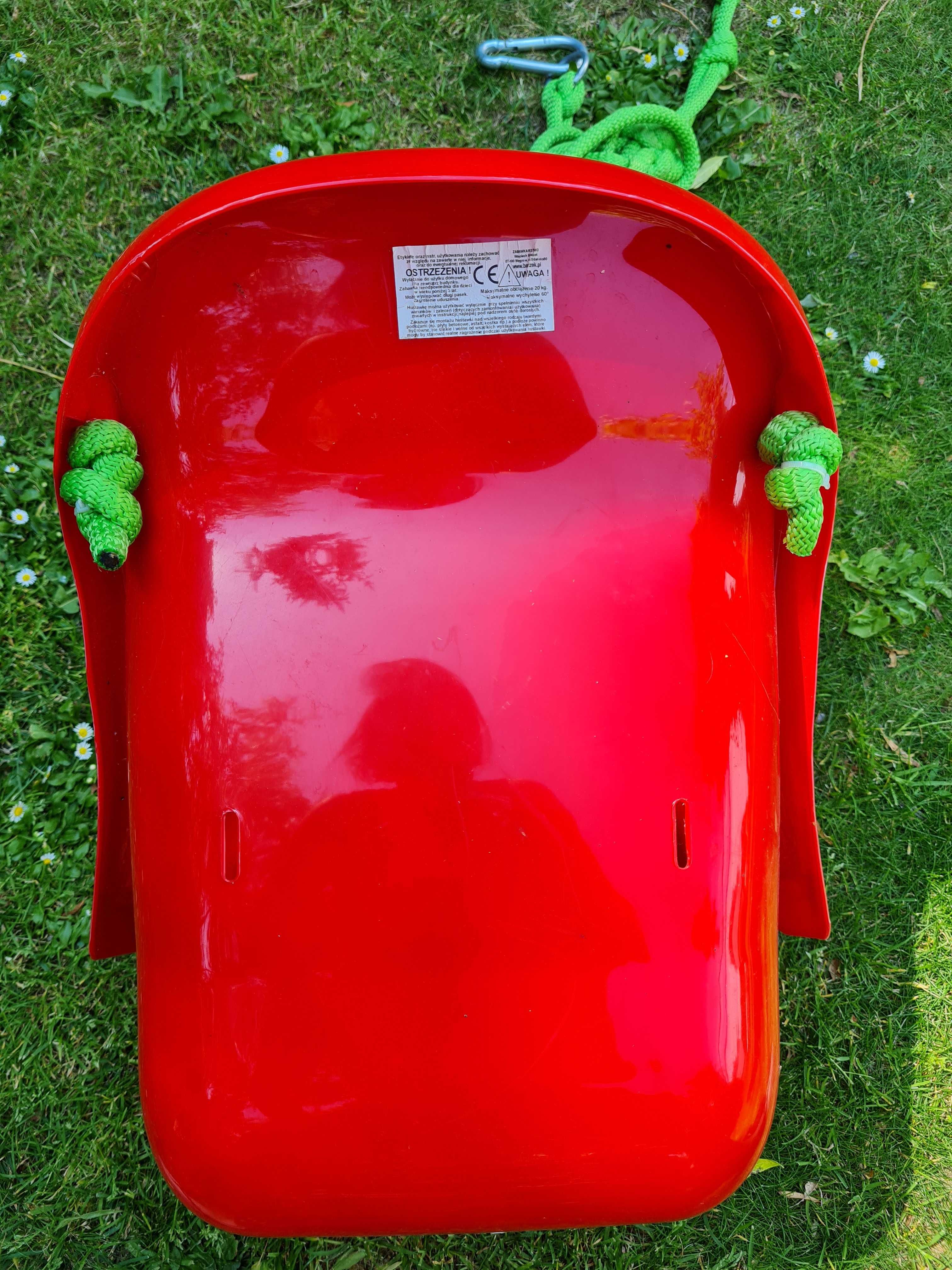 Czerwona huśtawka krzesełko bączek plastikowa do 20 kg dla dzieci