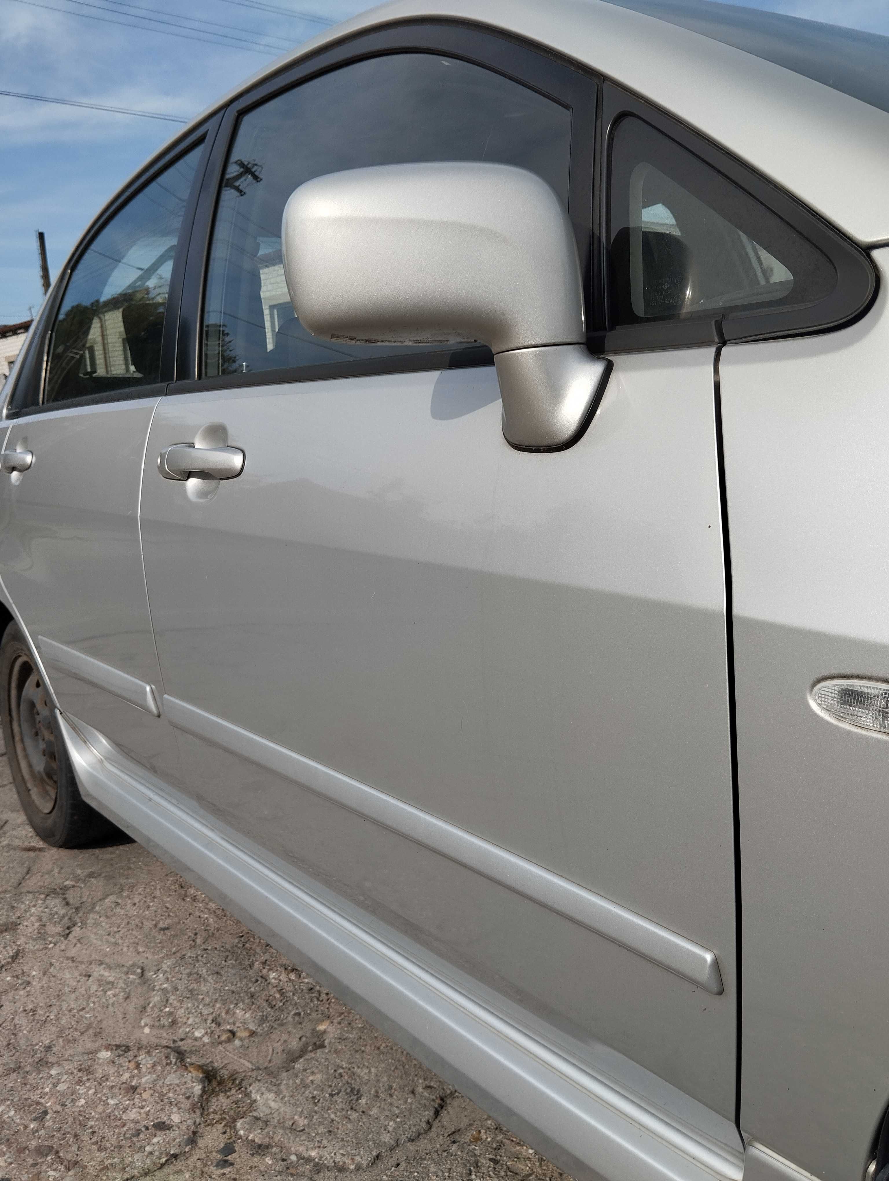 Suzuki Liana 1.6i 4D Sedan 2004r.Drzwi przednie prawe.