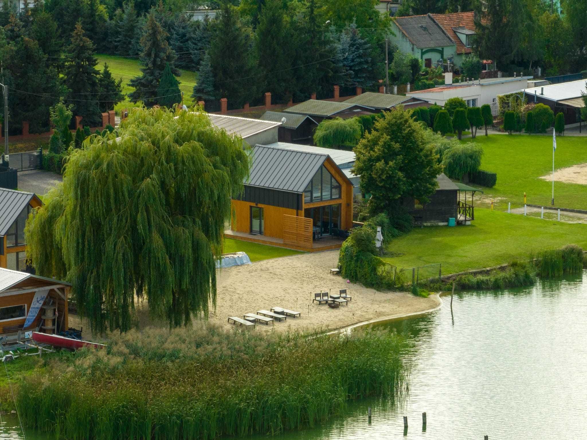 Domek Domki  Kunice  z własnym Jakuzzi  nad jeziorem prywatna plaża