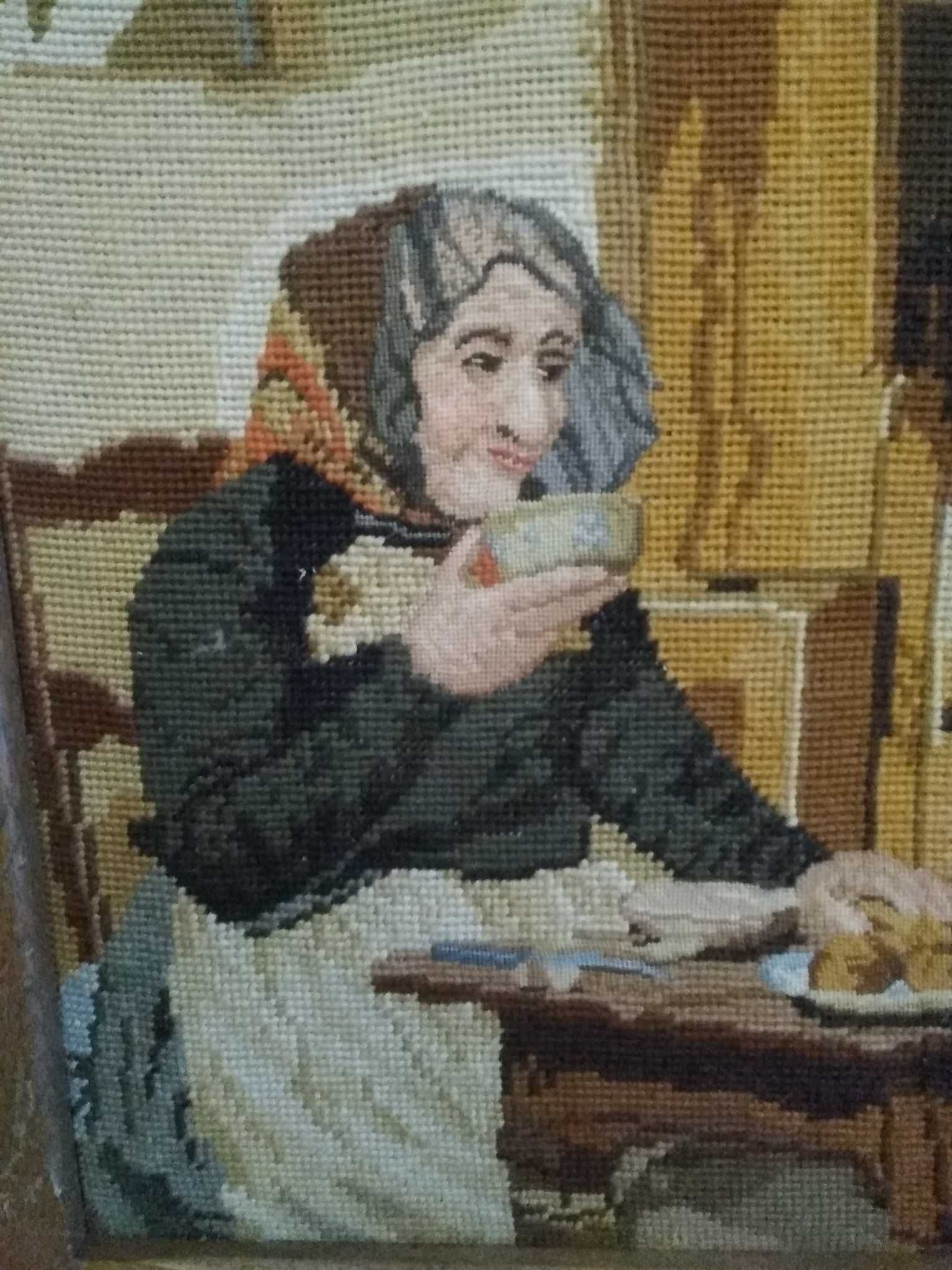 Obraz haftowany w drewnianej ramie kobieta przy stole