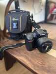 Camera Nikon D7100 + Objetiva Nikon AF-S DX Nikkor 35mm plus bolsa