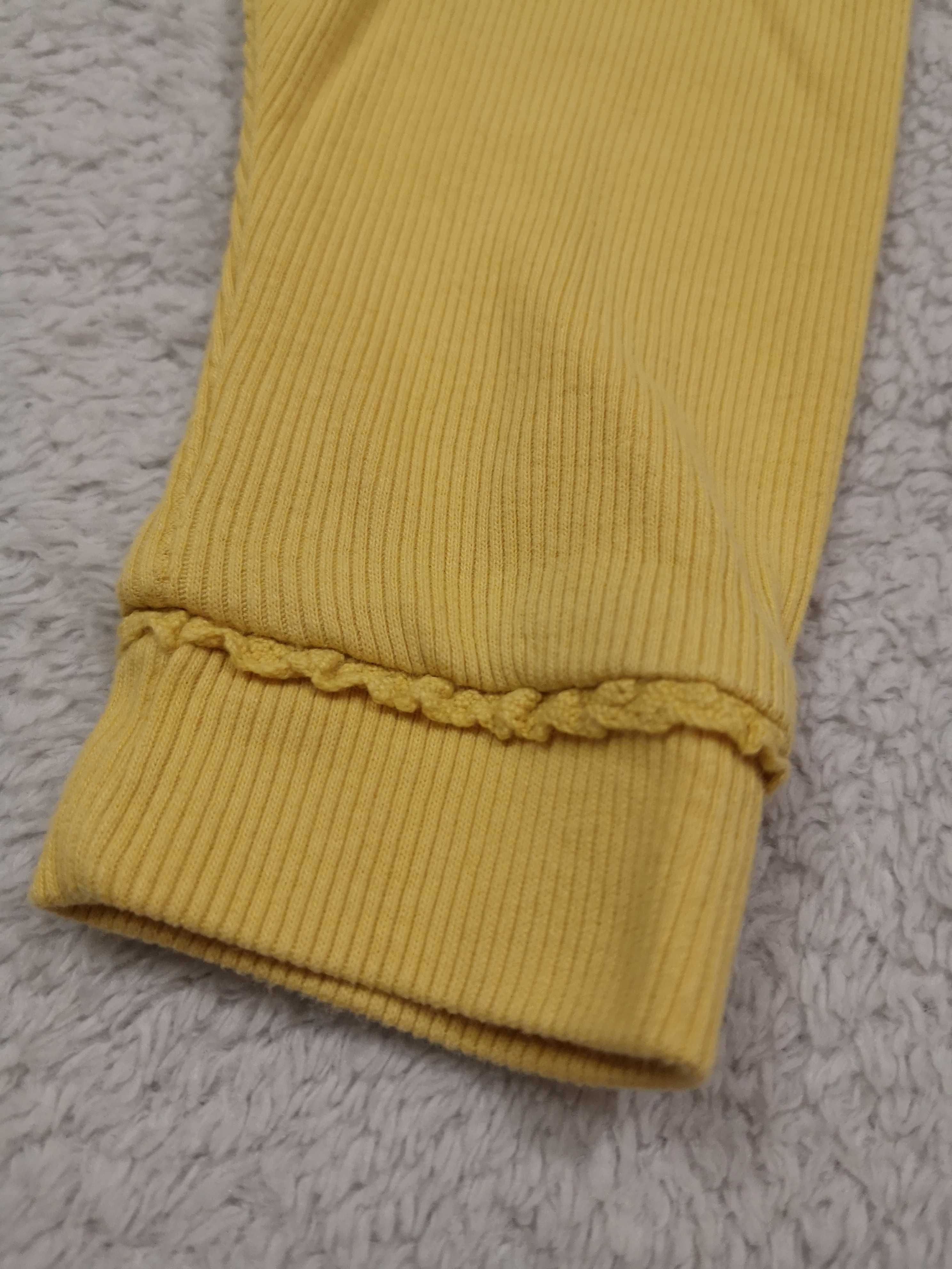 Żółte eleganckie prążkowane legginsy z falbanką Next 62 68 jak nowe