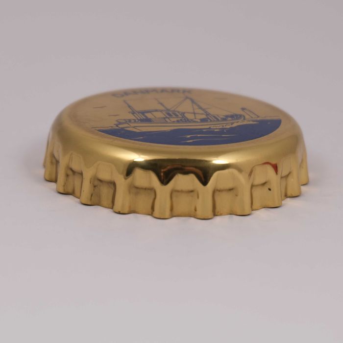 Otwieracz do butelek kapsel, Georg Jensen, Dania, lata 80.