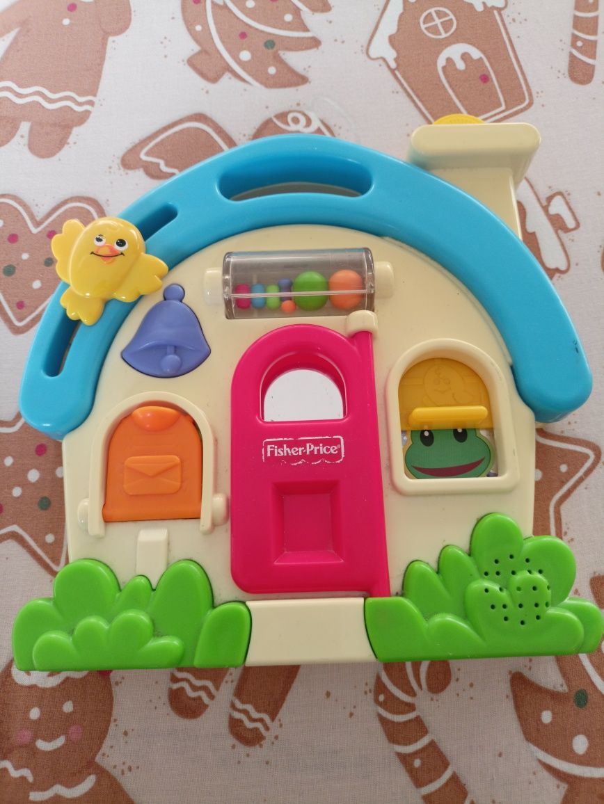 Domek manipulacyjny  fisher price wydaje dźwięki otwierane okienka