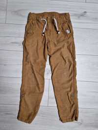 Musztardowe spodnie H&M  r 134