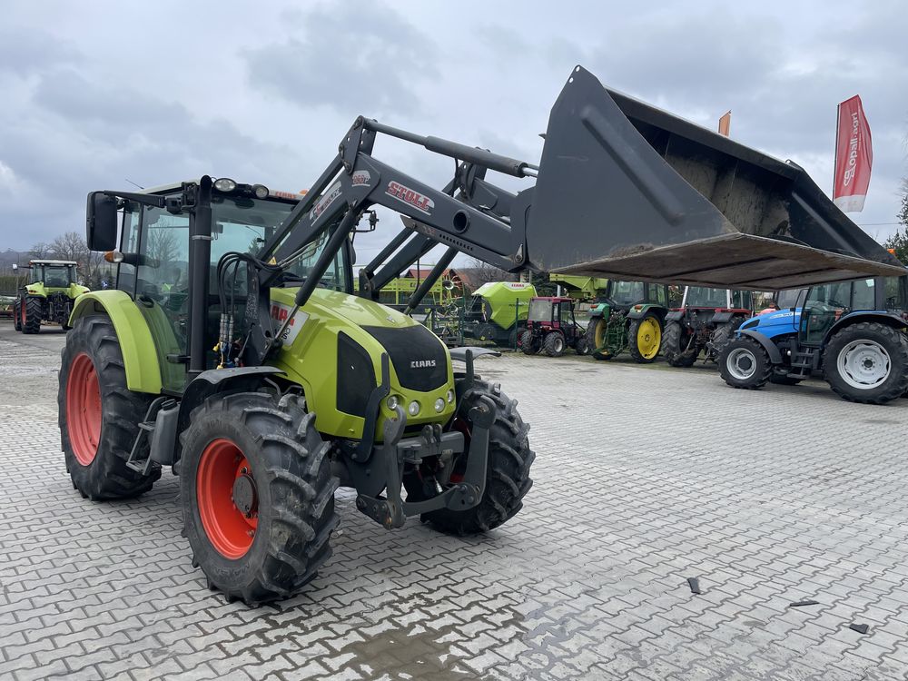 Ciągnik rolniczy Claas Axos 340 z turem tuzem