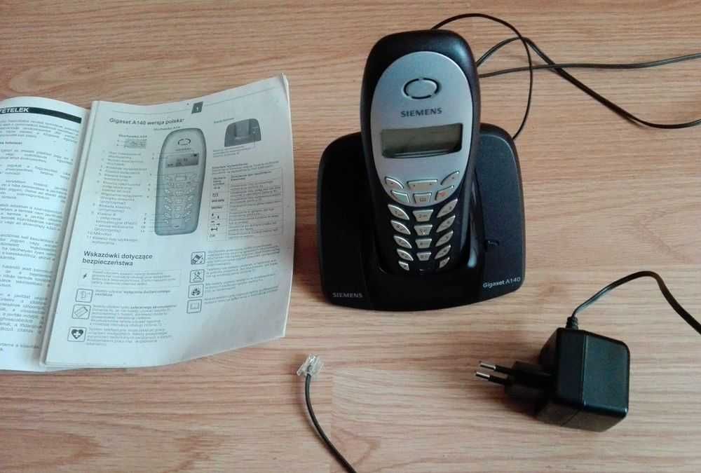 Telefon stacjonarny Siemens z ładowarką i instrukcją