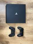 PS4 Pro 1 TB + 2 pady