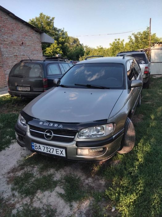 Opel Omega B,2,5 газ/бензин.