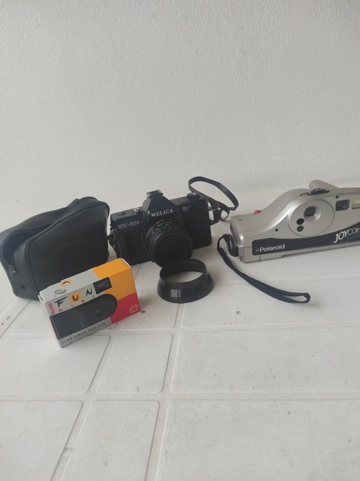 Conjunto de três máquinas fotográficas