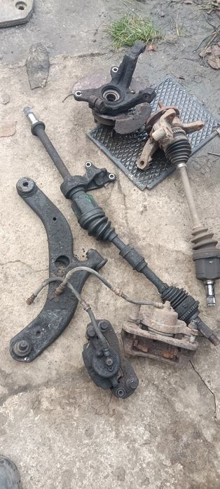 Стойки передние и задние Мазда 323 в сборе