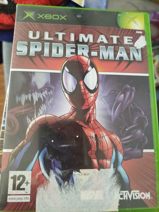 Vendo x box com dois comandos e 21 jogos.