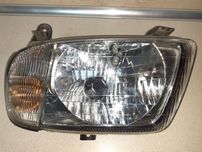 lampa przednia lewa reflektor DAIHATSU CUORE 98-02r.