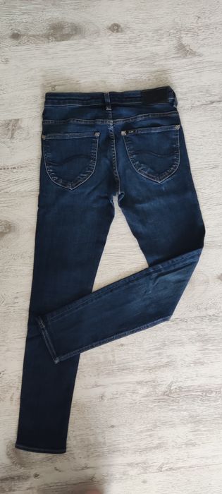 Spodnie jeansy Lee, rozmiar W28, L31.