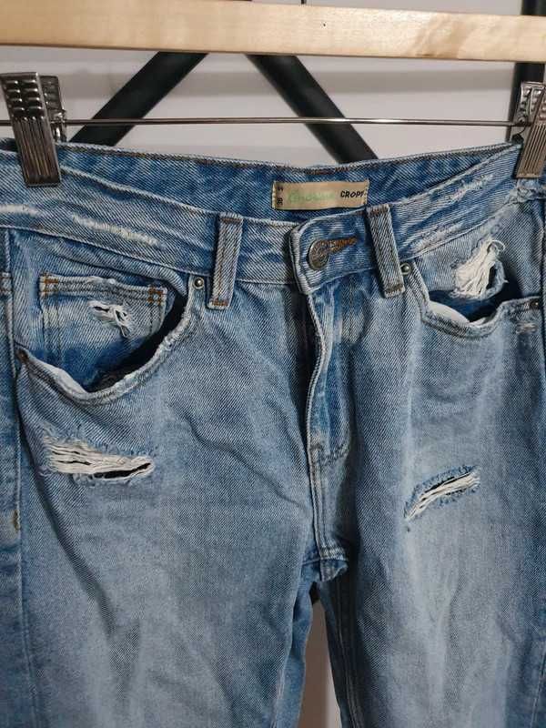 Wycierane spodnie z dziurami Cropp rozm 36