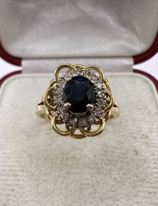 Złoty pierścionek 750 z szafirem 0,60ct i diamentami 0,16ct