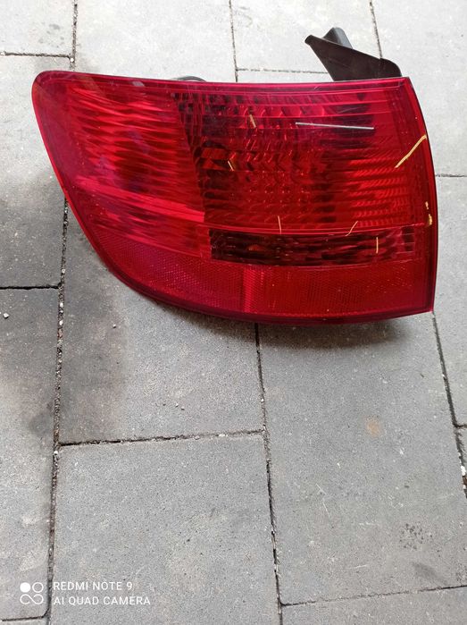 Lampa lewy tył W błotnik Audi A6 C6 kombi 4GL4