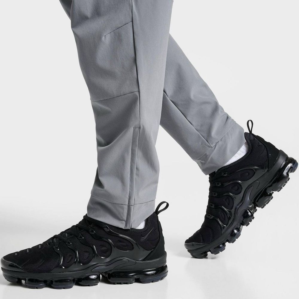 NIKE Dri-Fit Unlimited Tapered Leg tech fleece штани