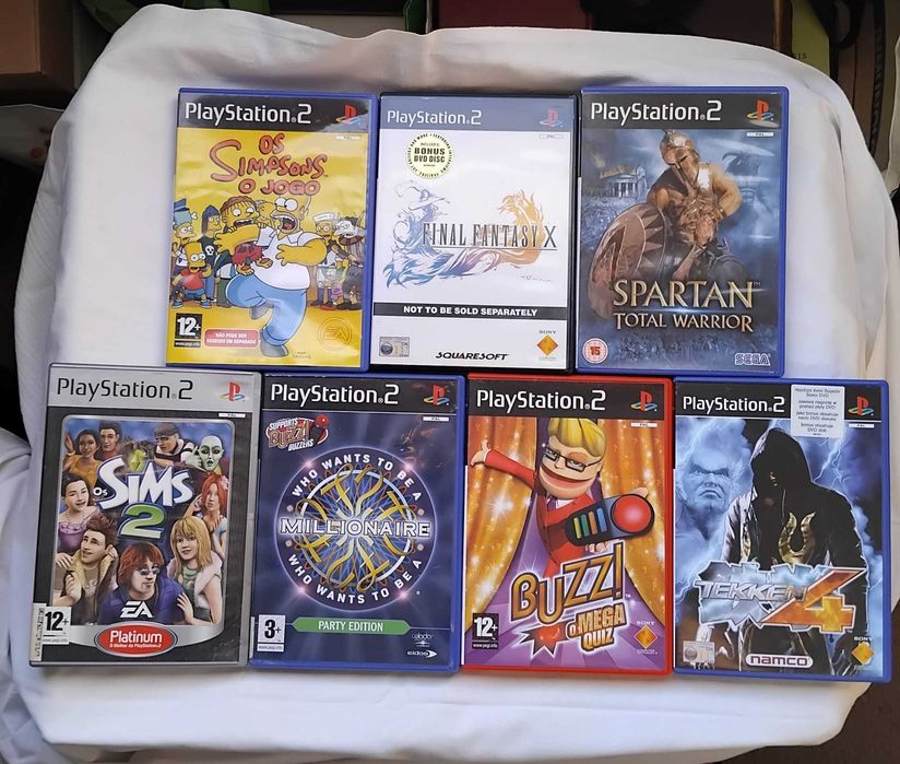 7 jogos PS2 + 2 Comandos, 2 de Buzz e 2 microfones Singstar
