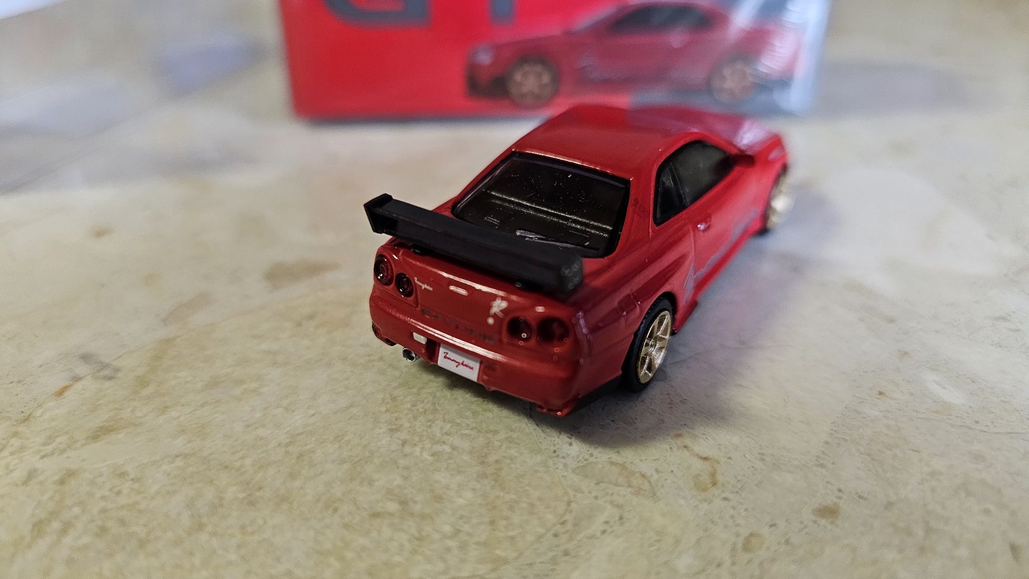 Mini GT 543 Nissan Skyline GT-R (R34) Tommykaira R RZ Edition Red