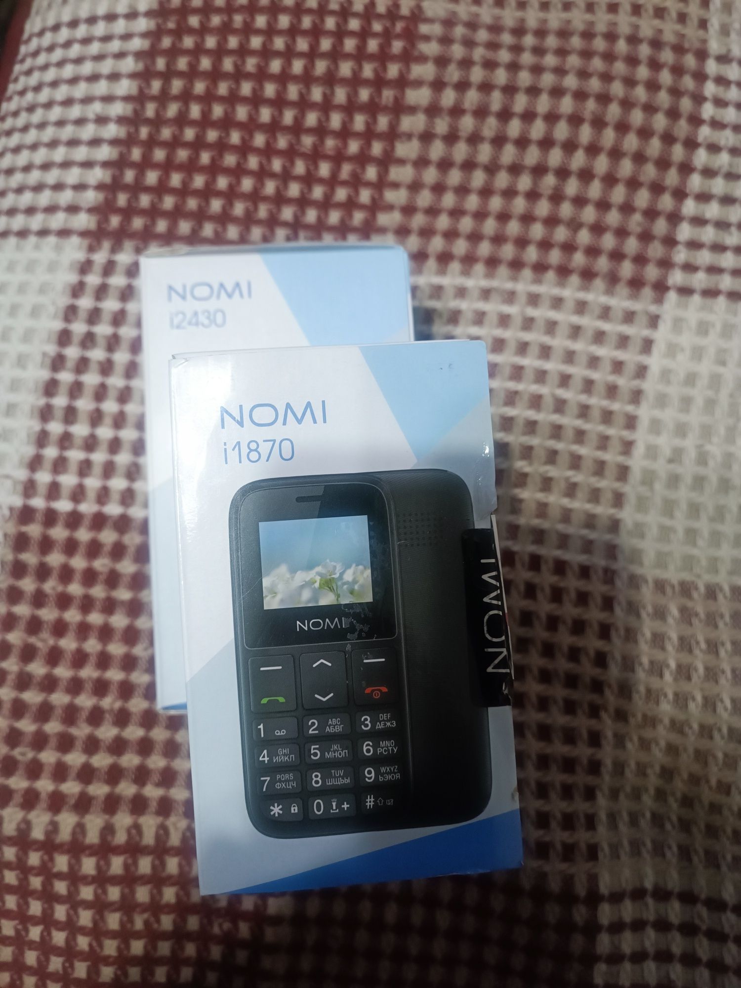 Продам новый кнопочный телефон nomi