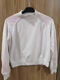 Biala bluza z cekinowymi rękawami rozmiar 164 Reserved