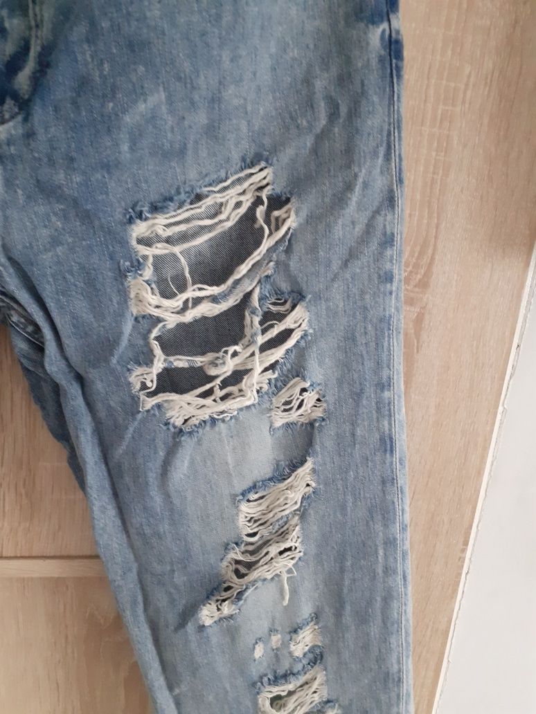 Topshop jeansy z dziurami 34/36