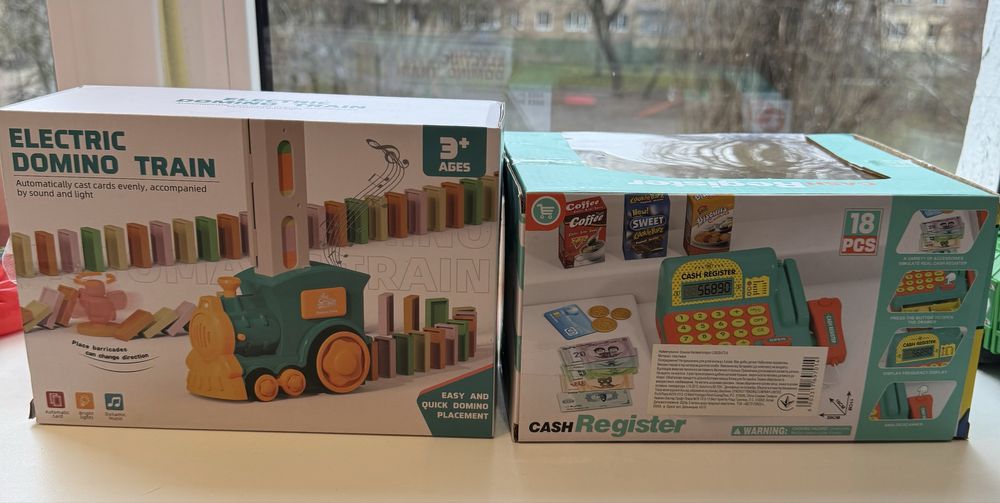 Лот Нові іграшки музичні в коробці поїзд доміно та касовий апарат