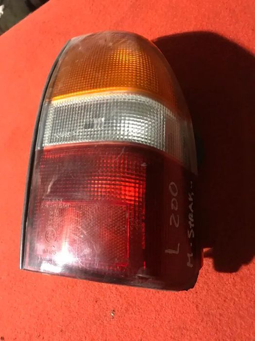 FAROLIM TRASEIRO MITSUBISHI STRAKAR