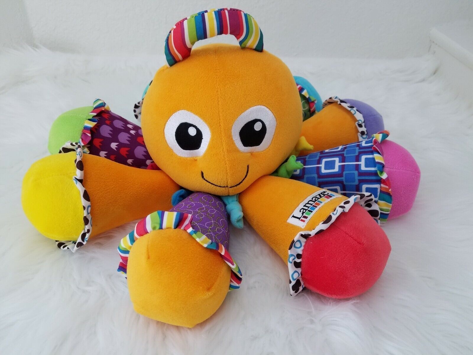 Детская музыкальная мягкая развивающая игрушка осьминог Lamaze