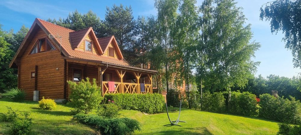 Domek nad jeziorem z linią brzegową na Mazurach Ryn Rybical - Staś