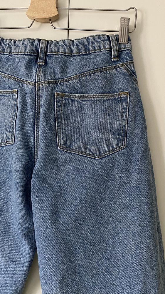 Modne szerokie jeansy z dziurami