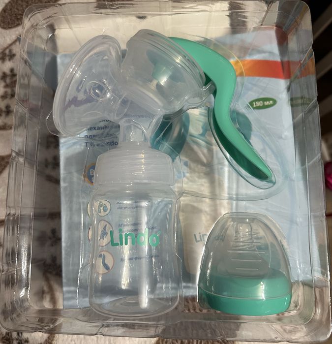 Молоковідсмоктувач механічний LINDO з пляшечкою для годування