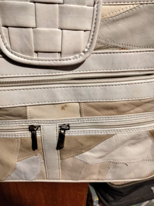 Mala em pele verdadeira.