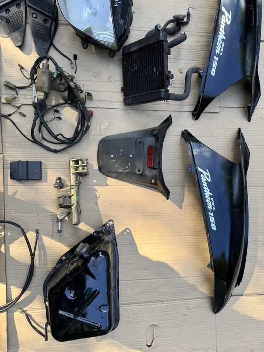 Honda Pantheon 150 owiewka lampa czujnik kiwak instalacja uchwyt wąż