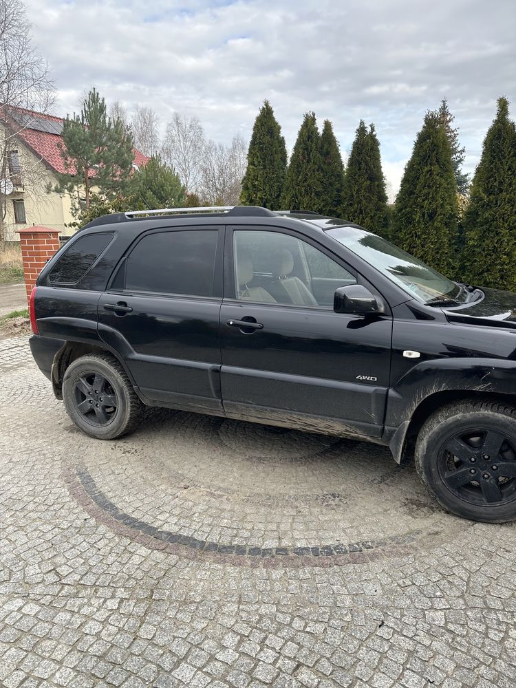 Kia Sportage II czarna  jasna skóra