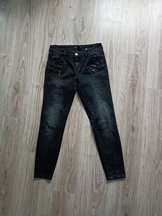 Czarne spodnie Sinsay 36 S z ozdobnymi zamkami